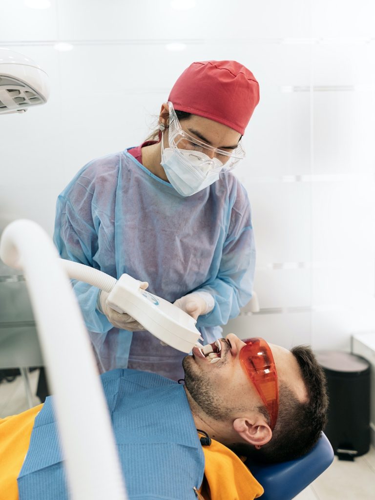Female Dentist Working with Patient